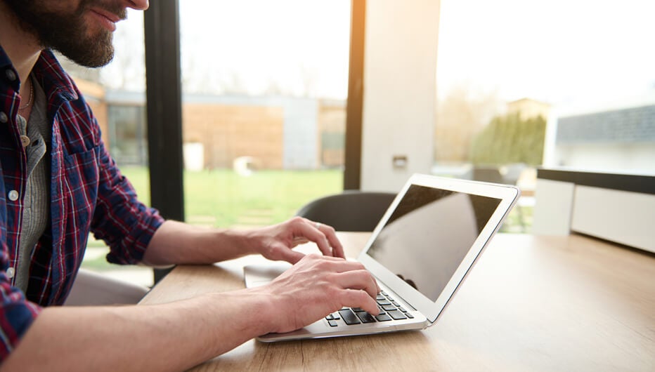 man laptop grass outside