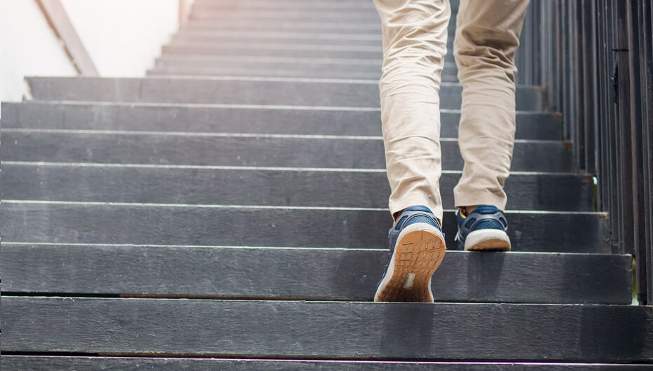 man walking up the stairs