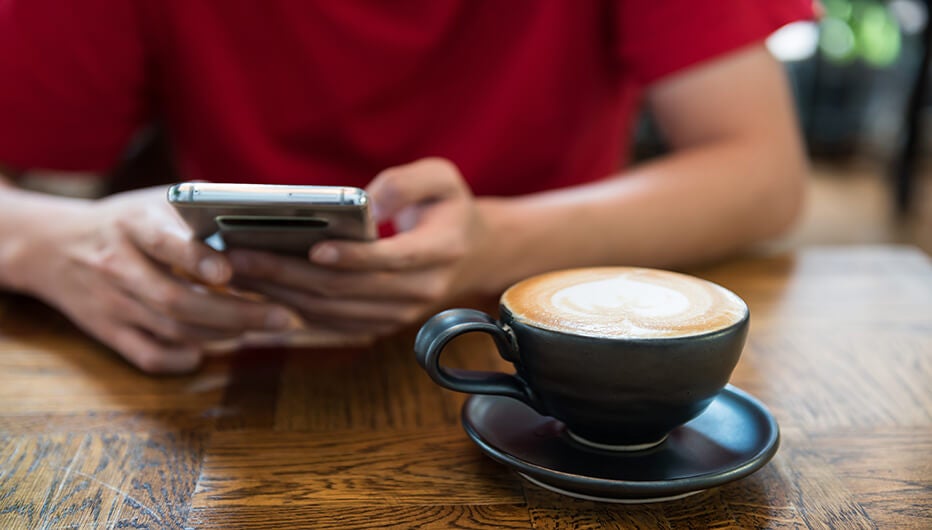 red shirt phone coffee