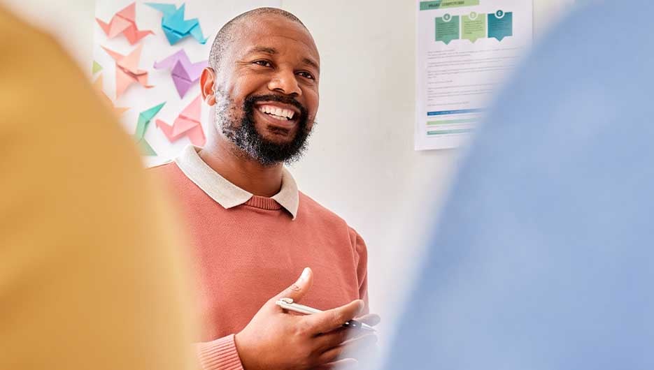 smiling man making presentation