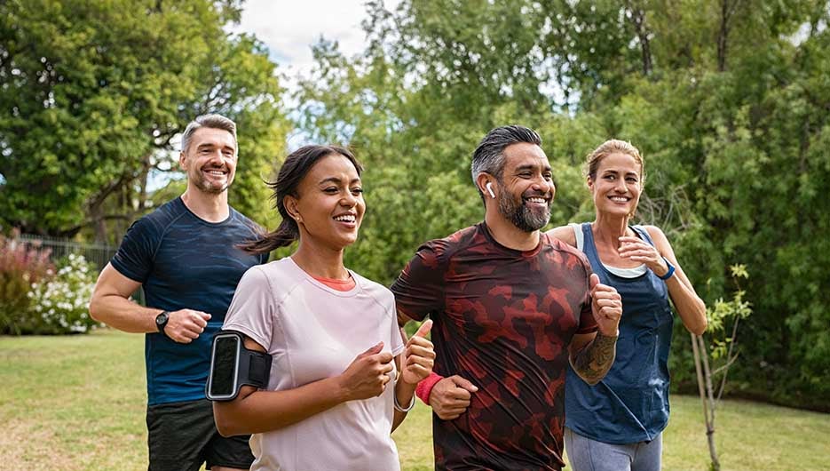 adults jogging in a park