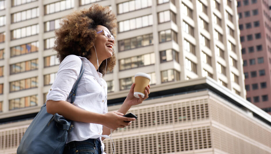 woman smiling building in background