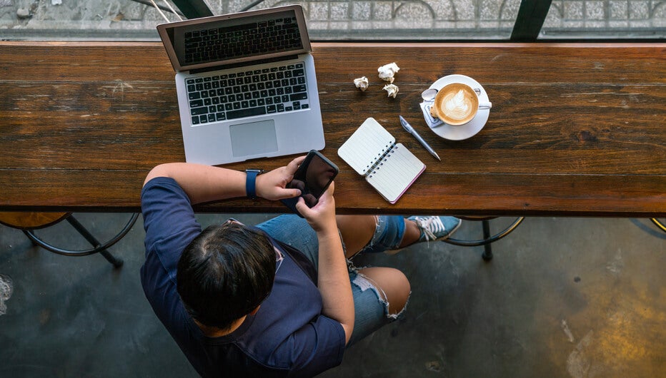 man with devices and coffee